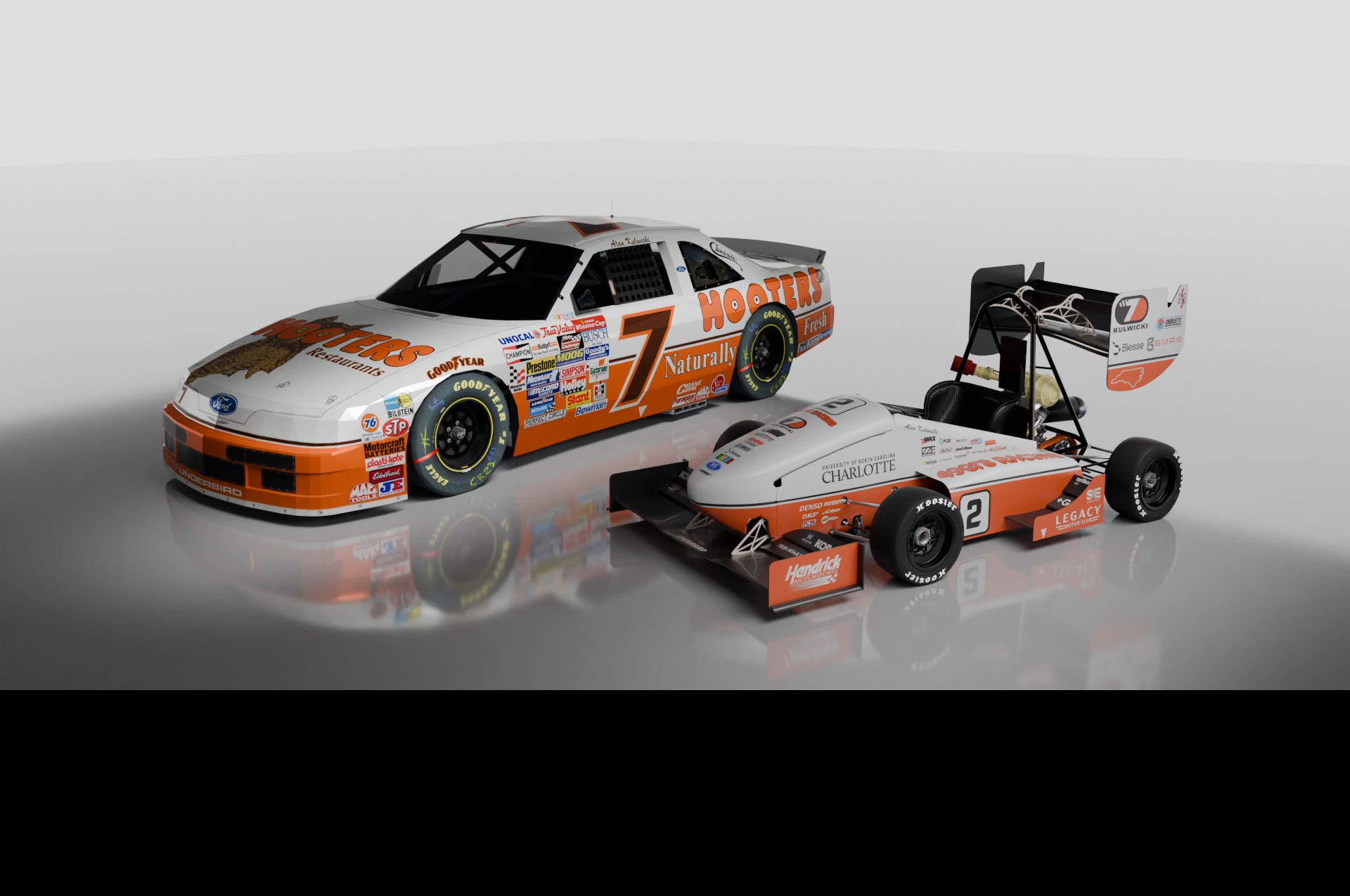 Photo showing Alan Kulwicki's race car beside the 49ers Racing Formula SAE race car