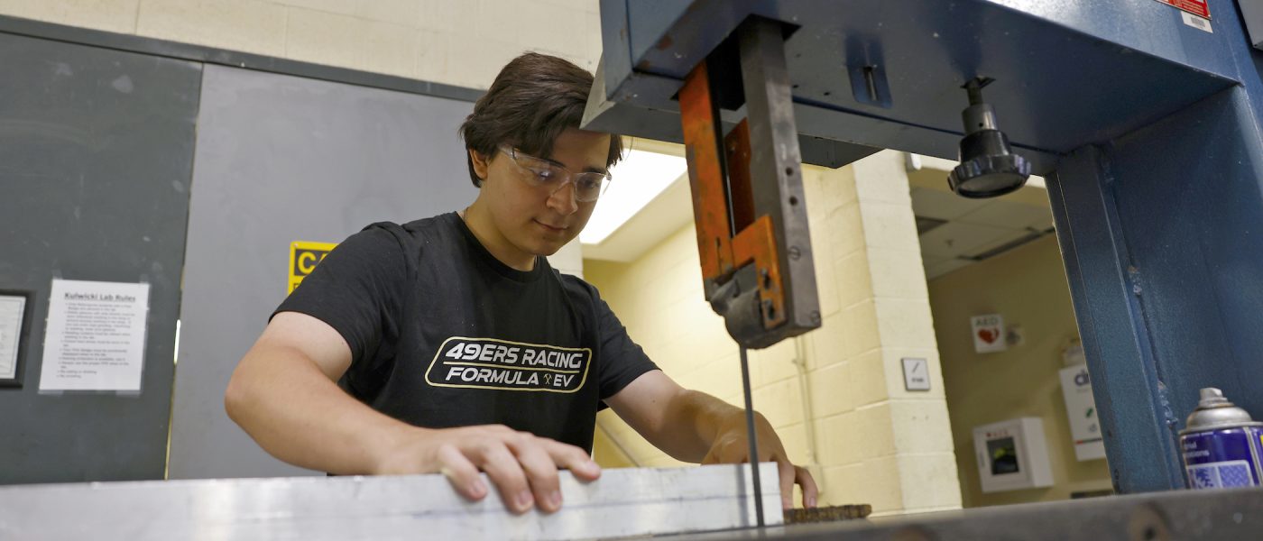 Student working with band saw